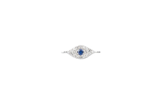 A 14k solid white gold evil eye connector charm with a central sapphire surrounded by smaller diamonds.